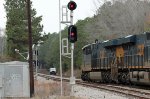 CSX 3016 leads a southbound train to a meet with a hi rail truck